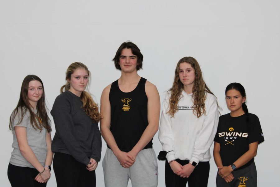 Iowa community rowers, Savannah Pisarik 24, Madeline Fincham 24, Liam Clarke 22, Izzy Greving 24, and Kimberly Marquez 22 pose for a photo. 
