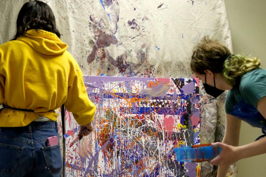 Yaffa Roarick 25' creating a collaborative splatter paint for the first session 