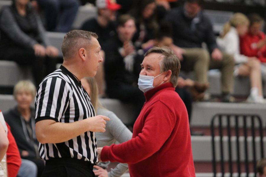Coach Bill McTaggart talks to the referee. 