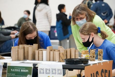 Students learn about native bird species while making bird feeders. Other activities for community members included face painting for children, information about local non-profit Field to Family, rock painting and stands about veganism, and voter registration from University of Iowa students.