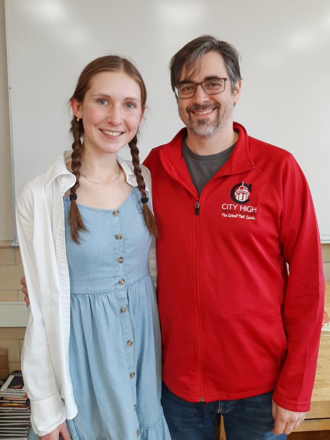 Anastacia Laux smiles with Dr. Ayers at the front of his classroom.