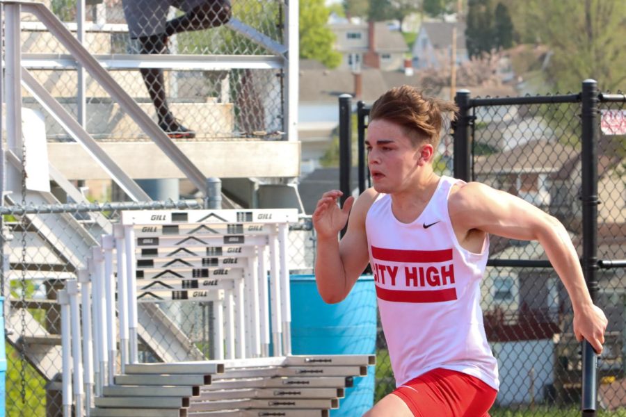 Mike Rew '23 runs the second leg of the sprint medley relay