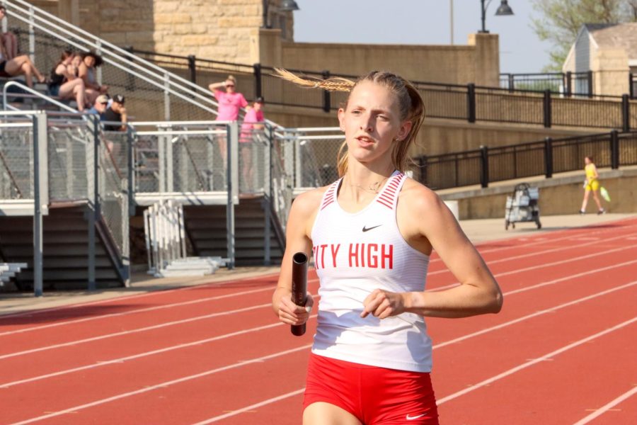 Lucy Corbin '22 starts off the 4x800. Corbin with Nina Peterson '25, Tatum Frazier '22, along with her team qualify for state