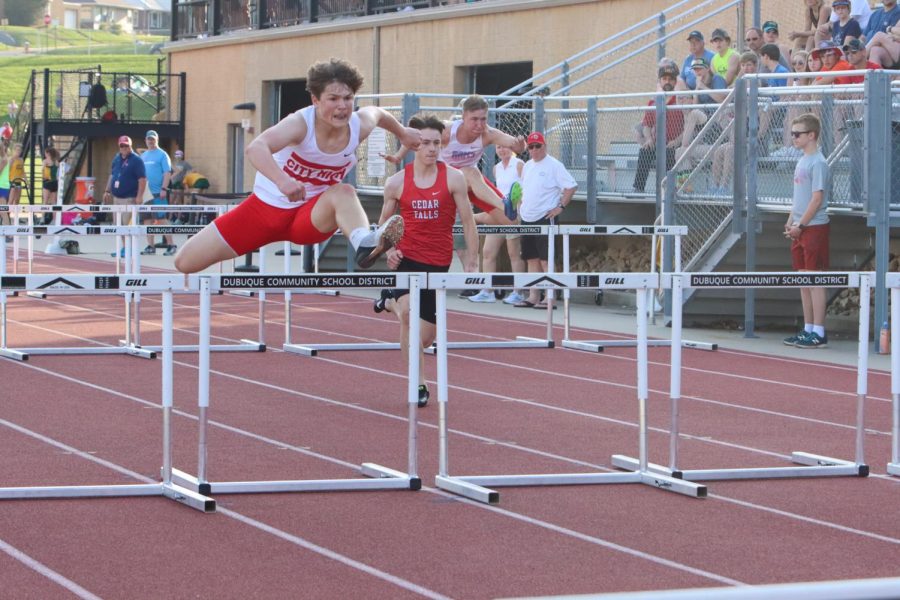 Ian Moore '23 runs the third leg of the 4x110 hurdle relay. Moore and his team, Philip Kaplan '24, Matt Schaeckenbach '23, and Austin Rindels '23