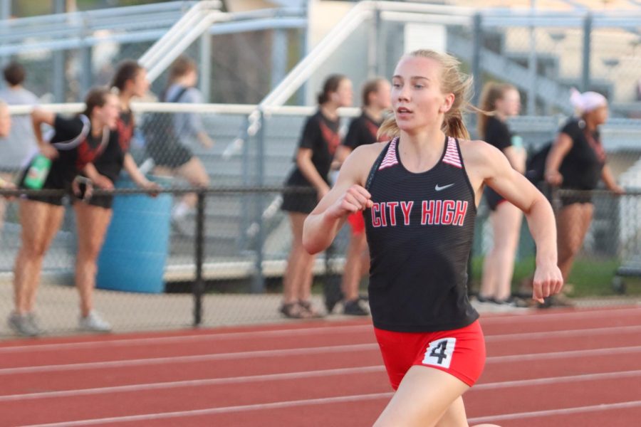 Ani Wedemeyer 25 runs in the 400 meter dash qualifying for state with a time of 57.78