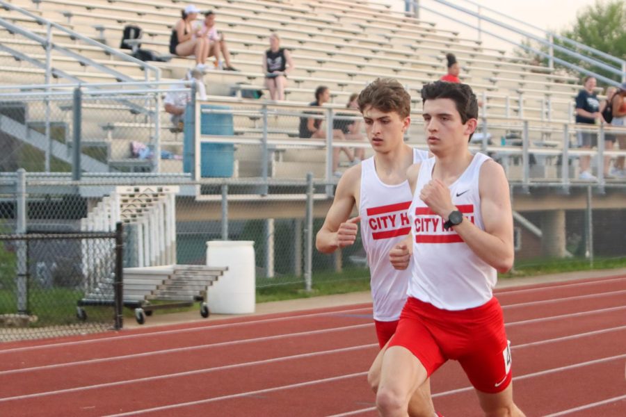 Ammon Smith '22 and Truman Thompson run in the 800 meter race. Thompson and Smith both qualified for state