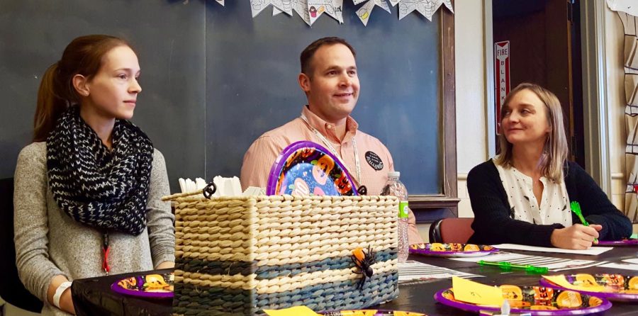 Siri Bruhn, Thad Sheldon, and Amy Kahle present in the front of a classroom