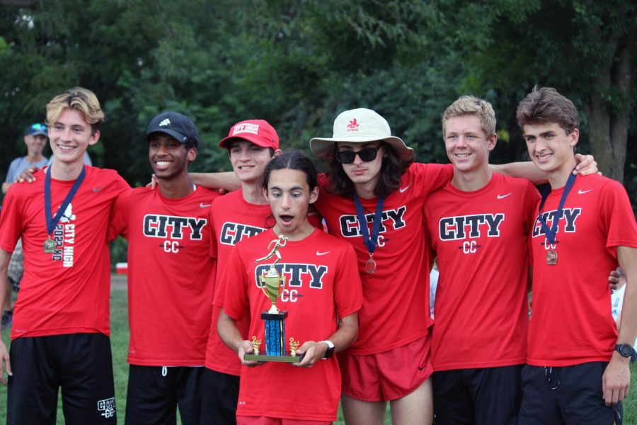 The varsity team celebrates a second place finish at the PV invite