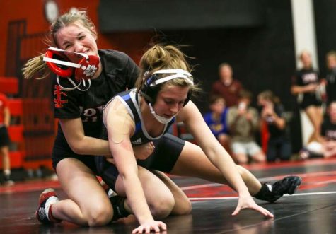 City Highs Sydney Wilkes Headgear is thrown off her head as she starts the last period on top during City Highs only home womens wrestling meet last year.