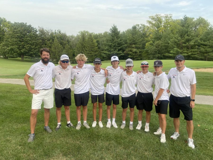 Little Hawk golf team celebrates win at West High meet.