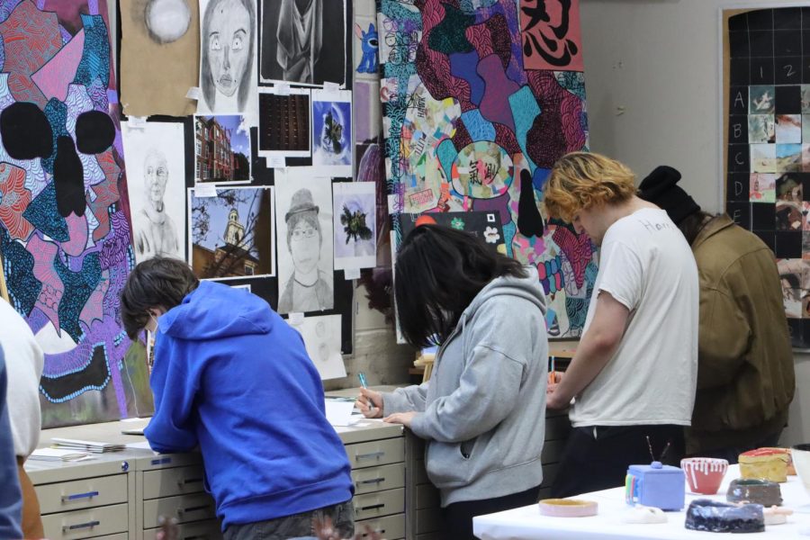 During the art show, students viewed art made with different mediums. 