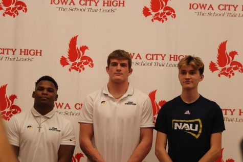 Gabe Arnold (left) , Ben Kueter (middle), and Ford Washburn (right) pose for a photo after signing to further their academic and athletic careers at a higher level