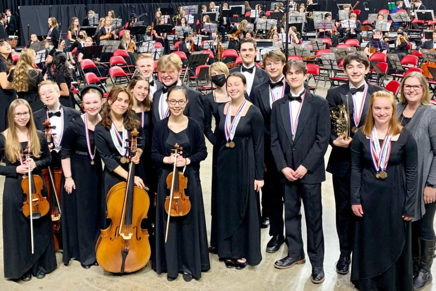 Orchestra members Abigail Sigafoose 26, Sebastian Sauder 24, Esther Puderbaugh 25, Marina Escandell-Tapias 24, Greta Stanier 23, Adam Zeithamel 23, Thomas Shey 24, Tai Caputo 25, Lucy Charis-Carlson 24, Kalea Seaton 24, Isaac Bullwinkle 23, Leo Burchett 24, Henry Smith 24, Matisse Arnone 23, Monique Schnoebelen 23, and Ms. Stucky-Swanson at All-State