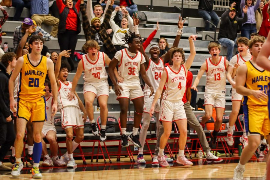 Thomas Ksobiech 23 makes the buzzer-beater shot with his teammates celebrating behind him last season