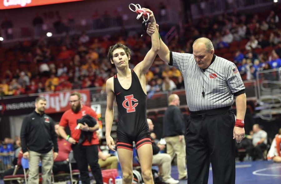 Chris+Davis+26+raises+his+hand+in+victory+at+the+2023+wrestling+state+tournament.