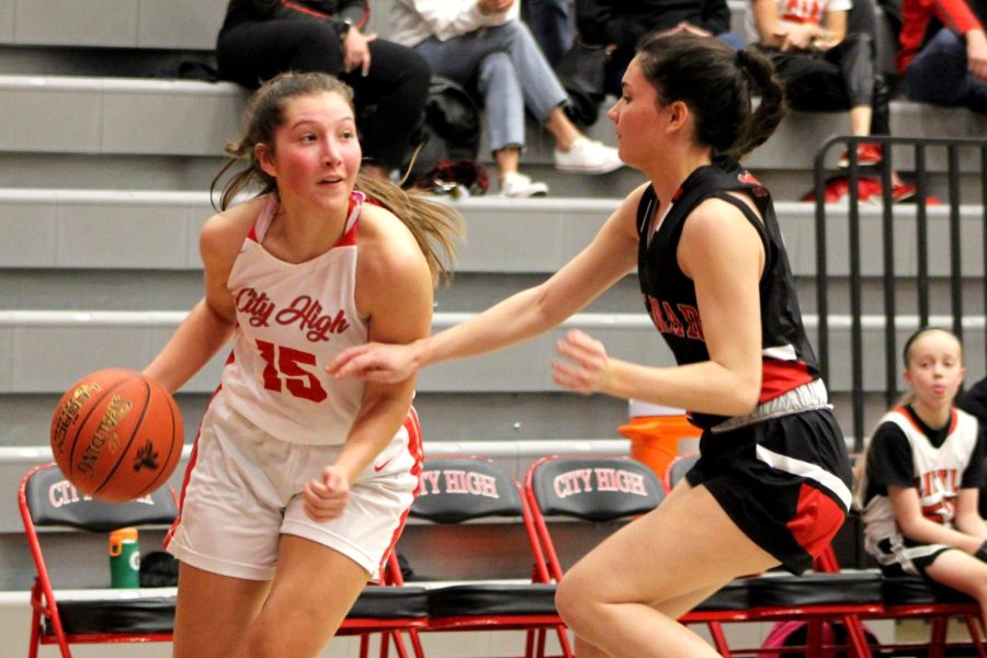 Senior Norah Jespersen drives to the bucket in the Little Hawk arena.