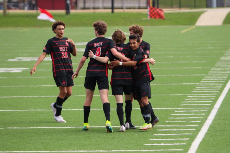  Thomas Ksobiech 23 celebrates a goal with Emmitt Hansen 23 and Andrew Lopez 23 