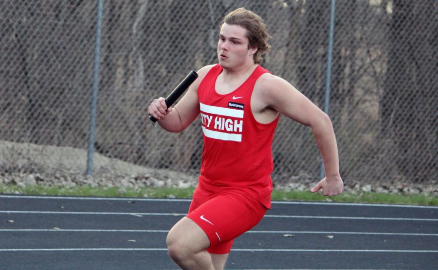 Holdon Clay 24 leads off the 1600 meter medley for the Little Hawks