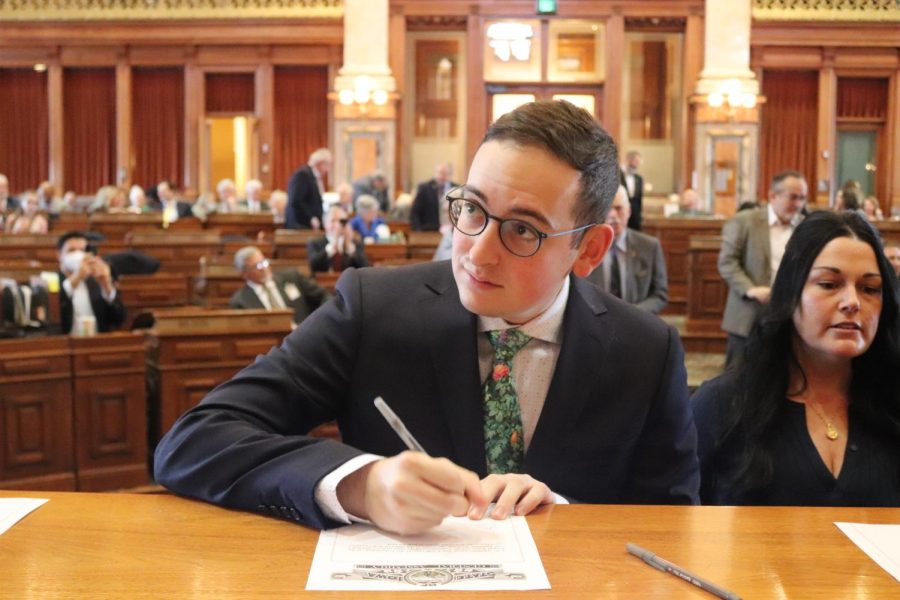 Zabner signing the oath of office. Photo courtesy of Adam Zabner.