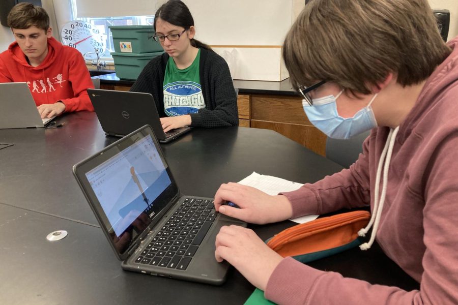 Kaden Huntley 25 and other members of Astronomy Club work together to design their solar system scale model.