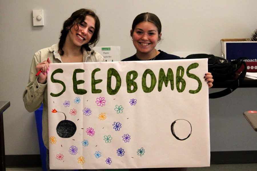 Margalit Frank 24 and Tully Campion 24 collaborate on a Student Senate poster.