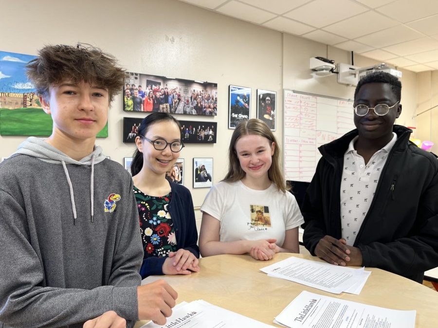 Jack Rogers 26, Tai Caputo 25, Esther Puderbaugh 25, and Wisdom Konu 24, stand in the journalism lab, where they created their stories.