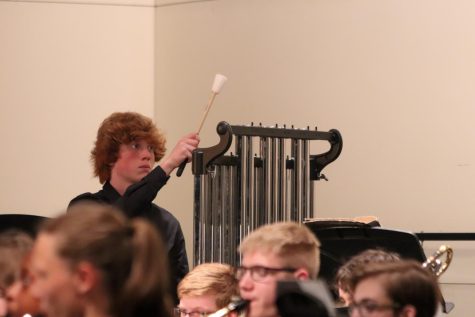 Daniel Kenyon 26 plays percussion in the band concert.