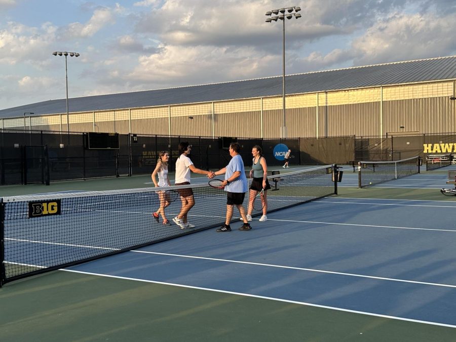 Coach Hightshoe and Vivian Tomek ‘23 shaking hands with Greta Stanier ‘23 and Adrian Bostian ‘23 after the match. Photo by Jill Tomek.