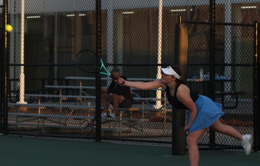 Vivian Tomek 23 reaches for a forehand.