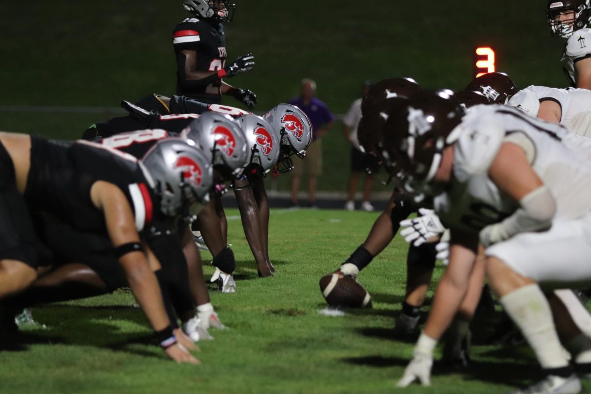 Little Hawk D-Line prepares for the snap vs Joilet Catholic.  