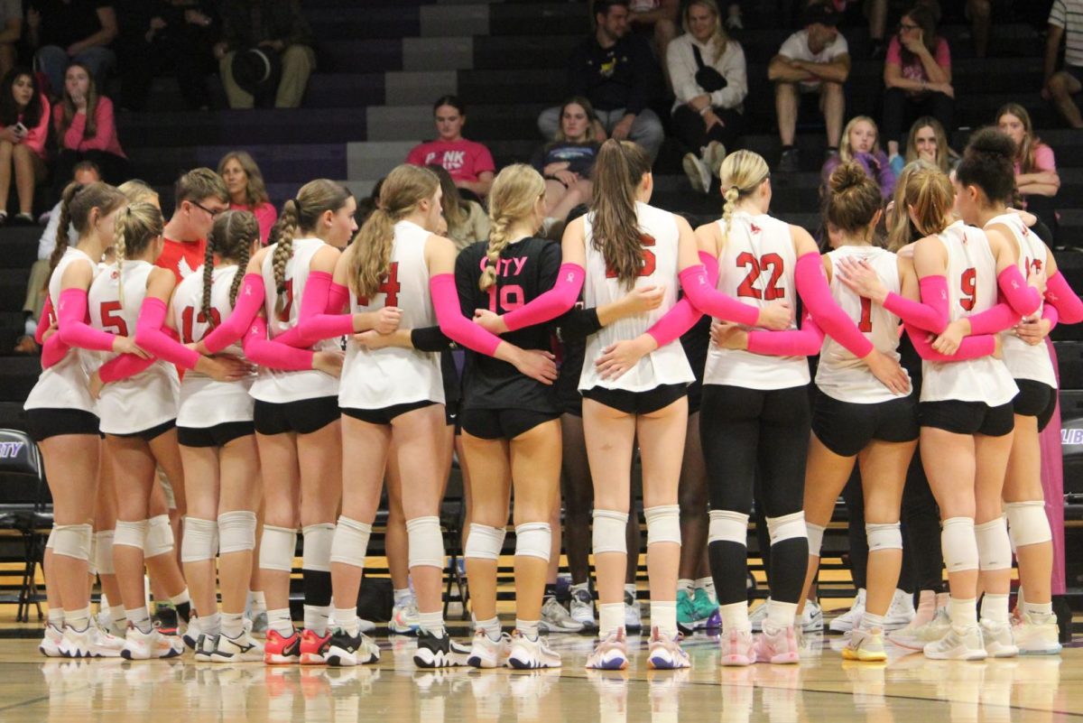 Iowa+City+Highs+Varsity+Volleyball+huddles+up+in+between+sets+during+a+match+against+Iowa+City+Liberty