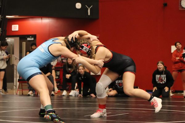 Paige Dixon 26 wrestles against an opponent from Cedar Rapids Jefferson at the home tournament
