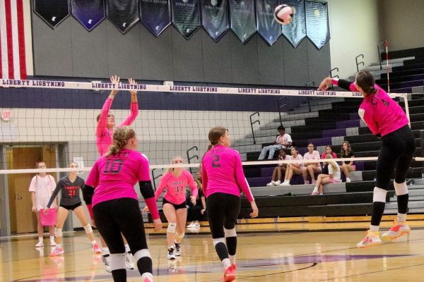 Maeve Obermueller 27 goes to spike the ball in a game against Liberty