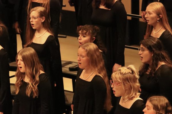 Members of Concert Choir sing on Choral Collage Concert in collaboration with choirs from West and Liberty High, as well as University of Iowa choirs at Voxman Music Building