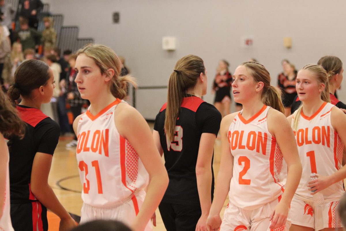 City Girls Basketball high fives members of the Solon team after last Tuesday’s game