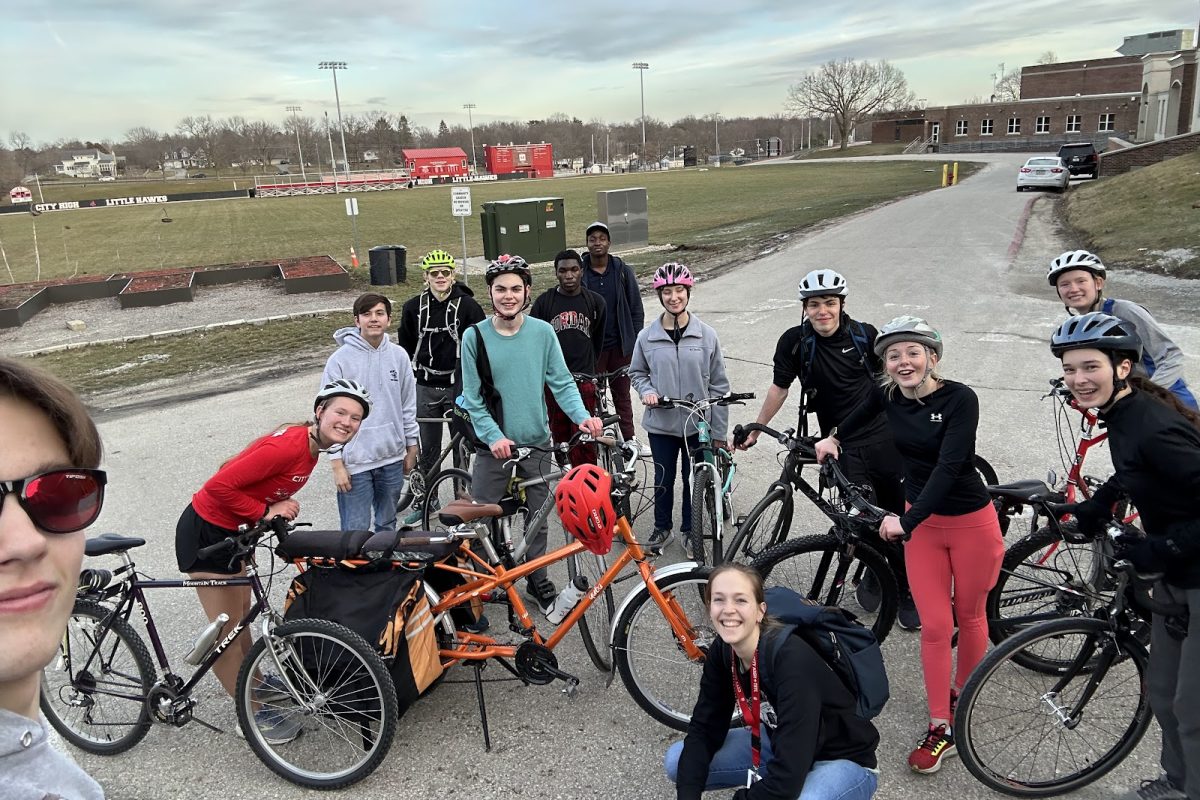 Members of Bike Club take a selfie together after delivering papers