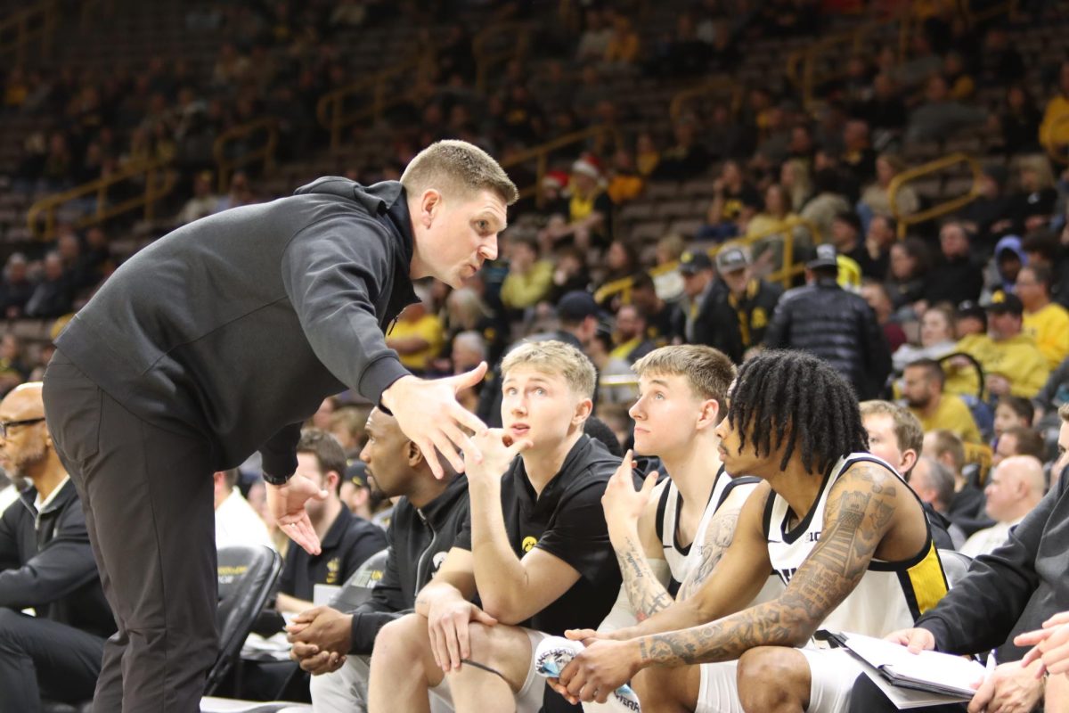 Matt+Gatens+coaches+his+players+on+the+sideline+in+a+game+against+UMBC.+This+is+Matts+second+year+as+an+Assistant+Coach+for+the+Hawkeyes