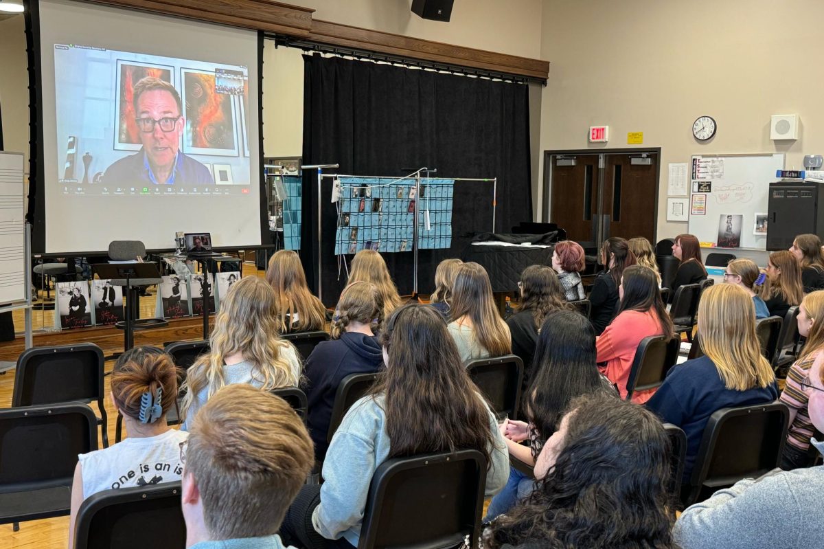 Concert Choir listens while composer Craig Hella Johnson answers questions