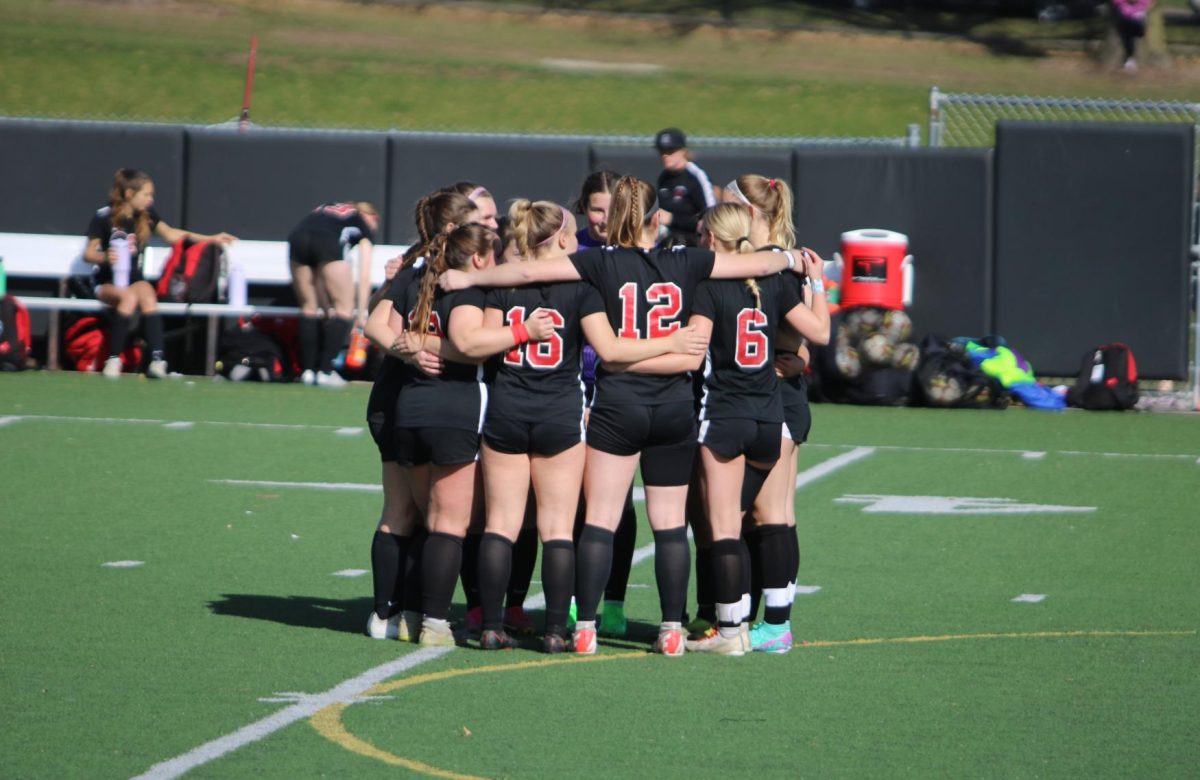 City High Women’s Soccer’s starting lineup huddles before a game against Davenport Central on April 4th