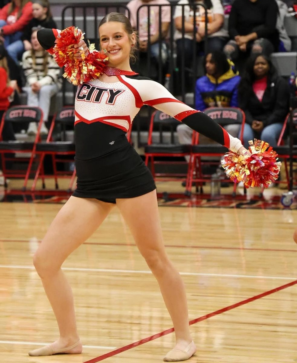 Performing at the City girls basketball game Josie dances with the City High Dance Team.