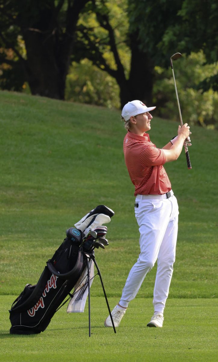Henry Birt '27 twirls his club after his approach shot on hole nine at Pleasant Valley. Henry stuck this shot to about 10 feet from 130 yards out.