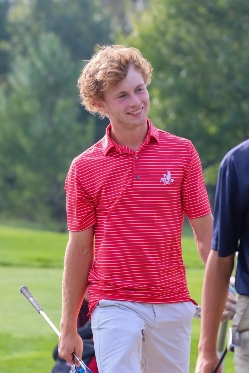 Del Brewer walking off the 1st green at Pleasant Valley Golf Course. This is Del's first full year on Varsity and it looks like he has been playing Varsity his entire highschool career.