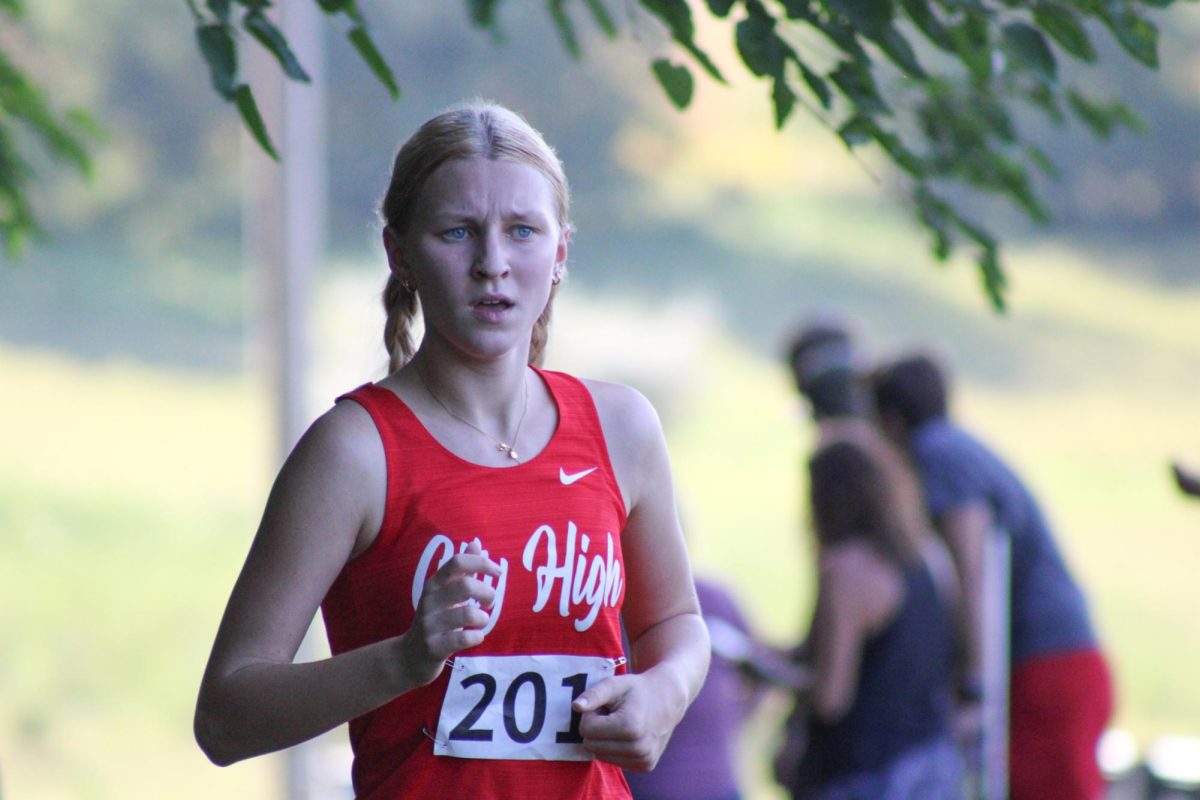 Willow Schultz '27 races, finishing 9th with a time of 24:03.