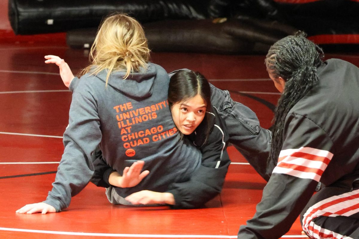 Sterling Dias demonstrates a move on Ruby Slemmons '28 . At The Little Hawk tournament, Manuel finished sixth.