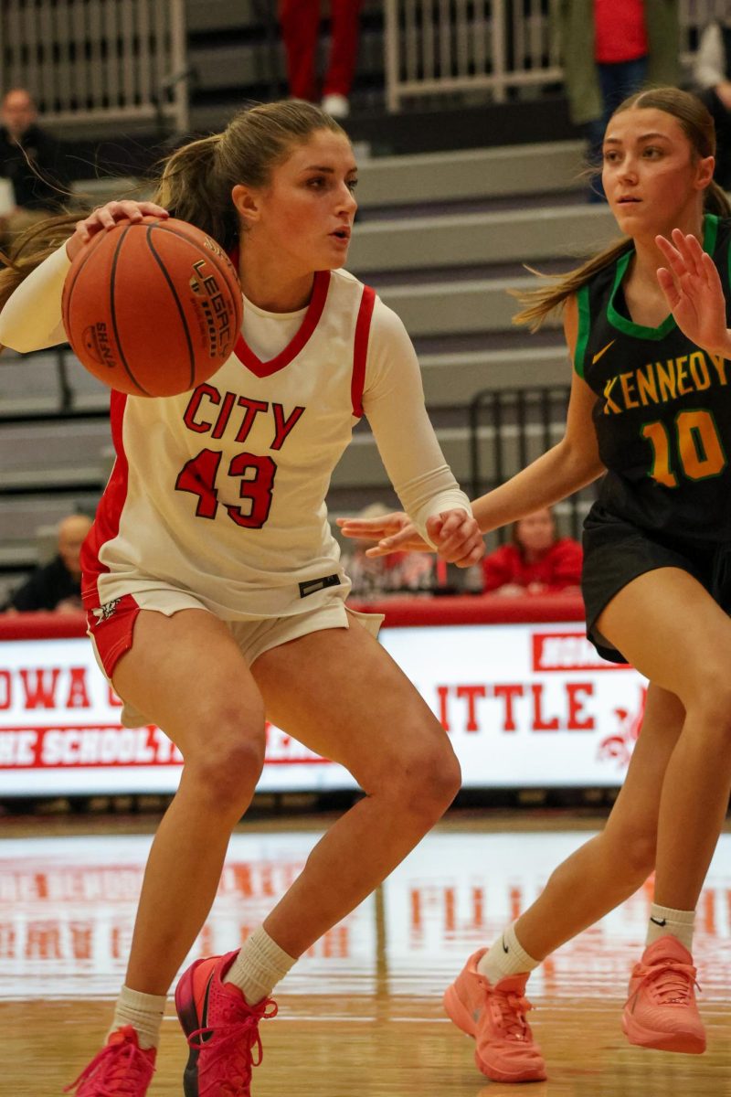 Tessa Driscoll stampedes down the court toward the basket.