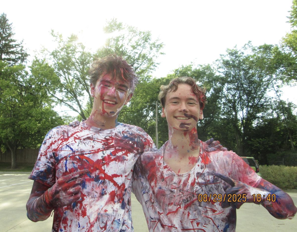Lukas Schoen '26 and Arik Dinkel '26 pose together at the Senior Paint Fight.