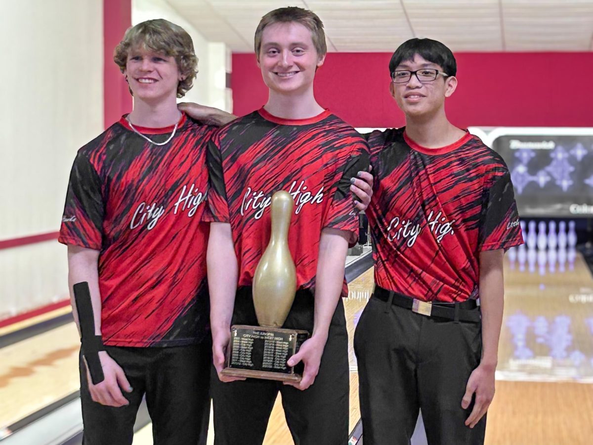 Left to right: Trendon Walker, Cal O’Brien, Nathan Voudhivong claim the King Pin by beating West High.