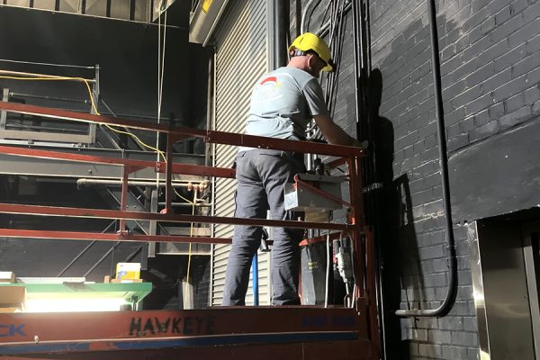 Construction workers place and update lights in Opstad Auditorium.  The new lighting system should be in place by March for the spring musical.