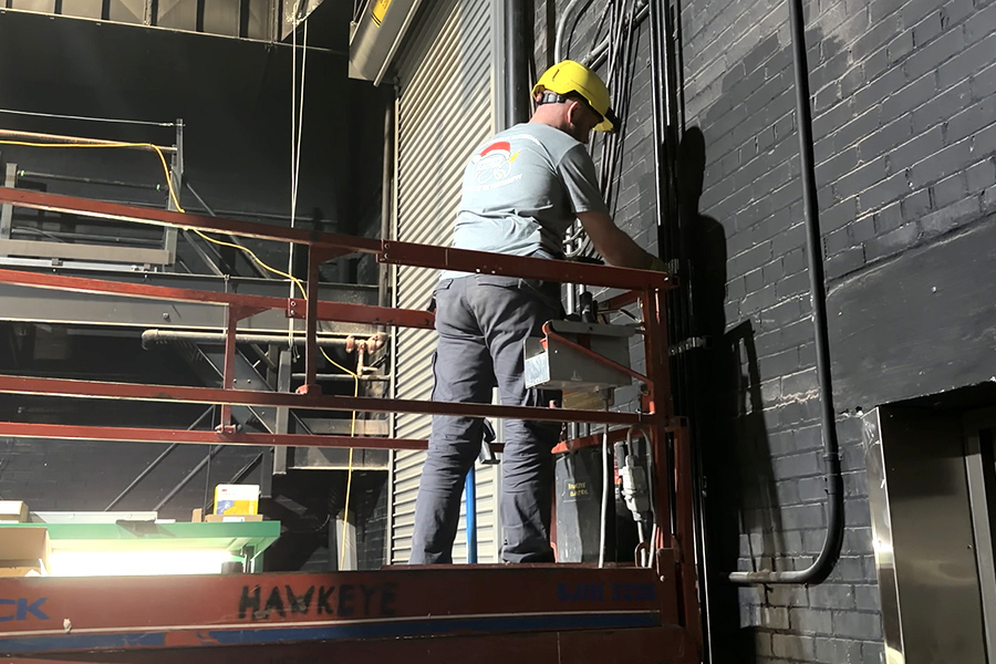 Construction workers place and update lights in Opstad Auditorium.  The new lighting system should be in place by March for the spring musical.
