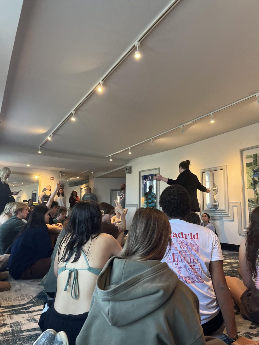 A representative from Gateway, the travel company managing the trip, explains the situation to the group stranded in Chicago on Thursday morning.